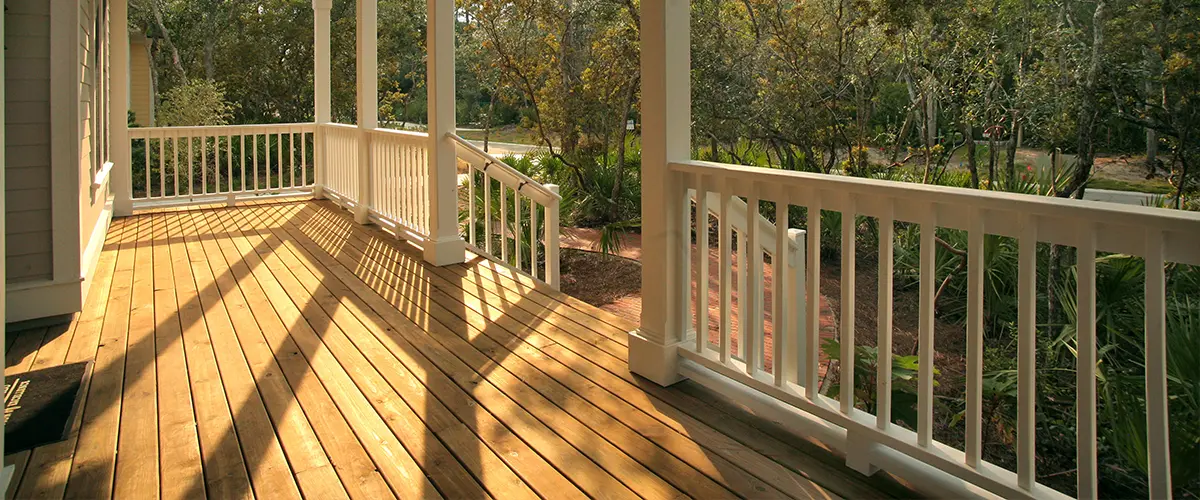 A cedar deck with white railing