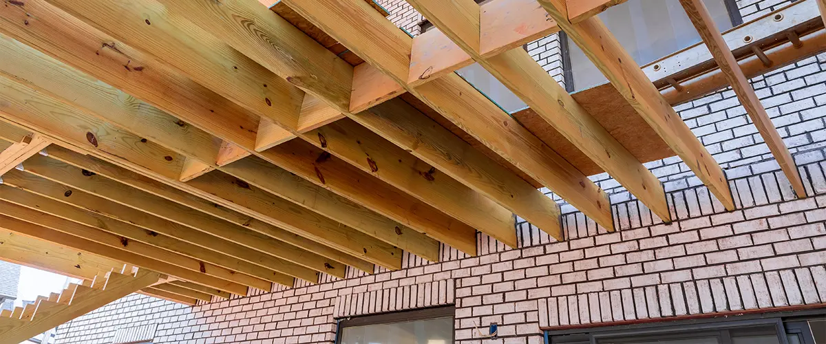A deck frame photographed from beneath