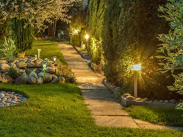 Lighting fixtures on a pathway in a backyard