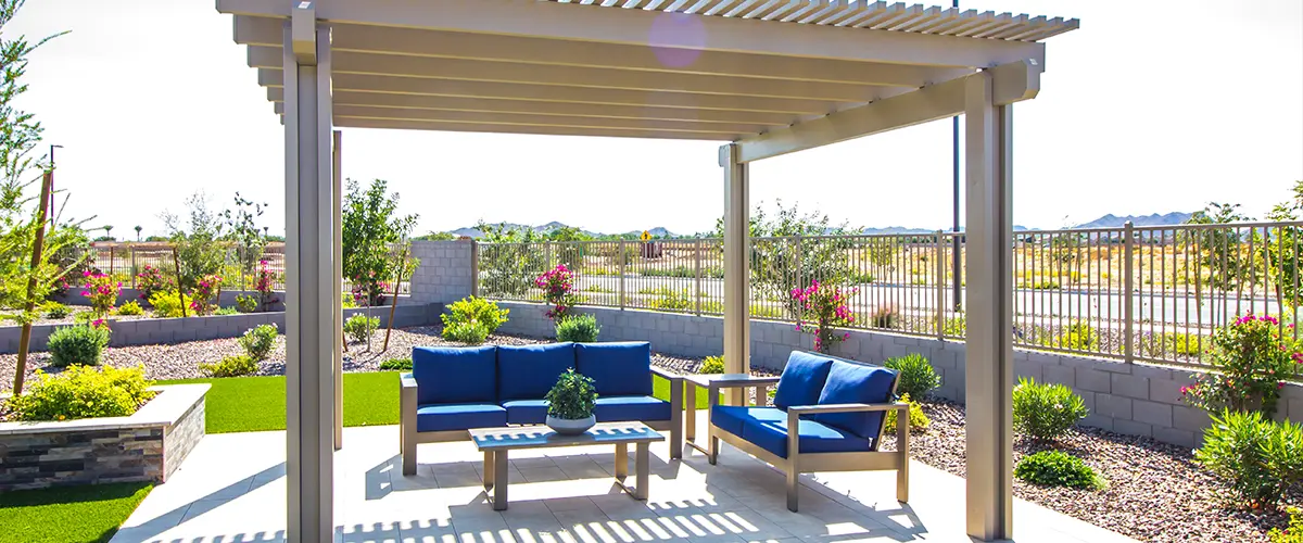 A concrete patio with a pergola