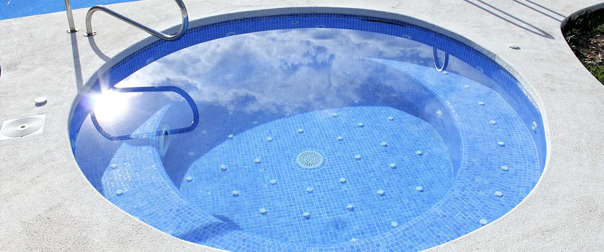 A hot tub in a pool