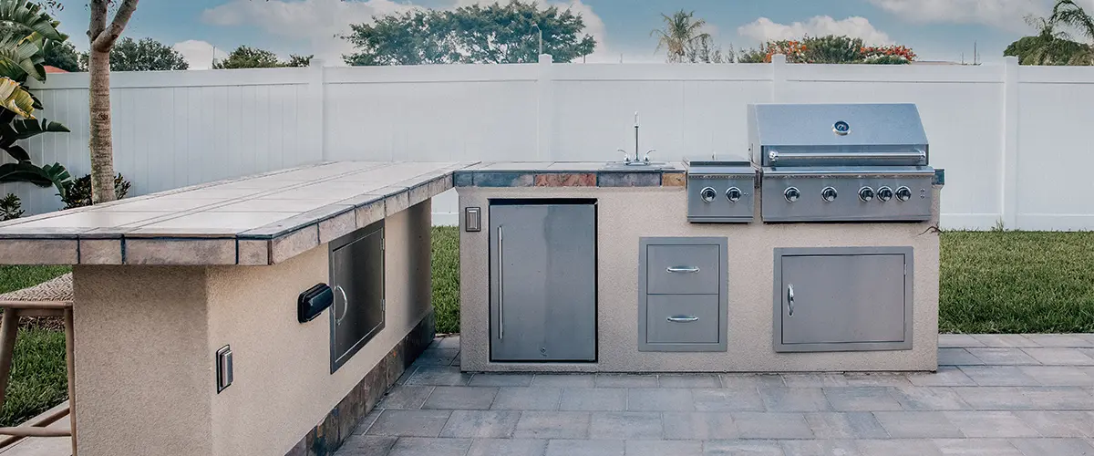 outdoor kitchen island with a grill area