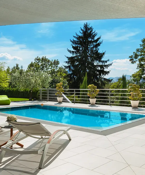 High-end pool on a property with concrete patio