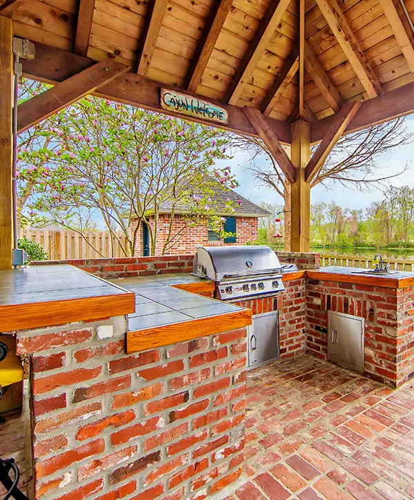 Outdoor Kitchens In Lewisville brick outdoor kitchen with wood covering