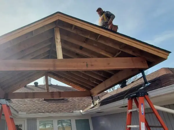 worker on the roof of a patio