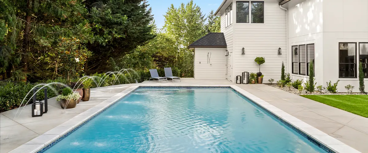 Swimming pool in backyard of house