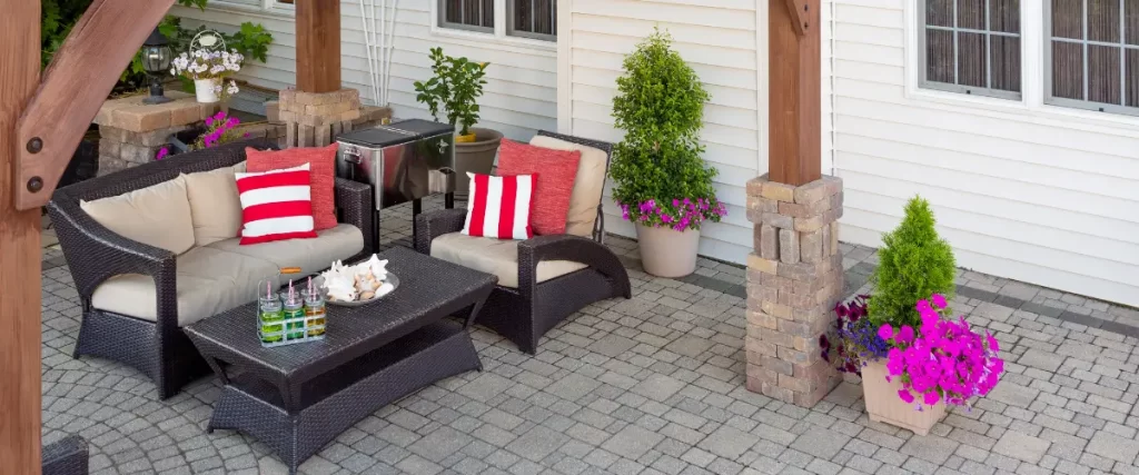 Cozy patio with cushioned furniture and potted plants