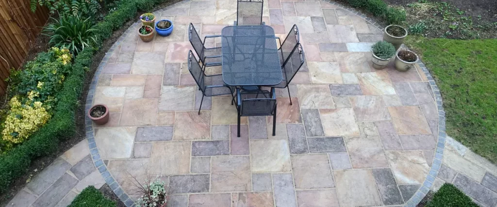 Outdoor dining area on a multi-colored stone patio