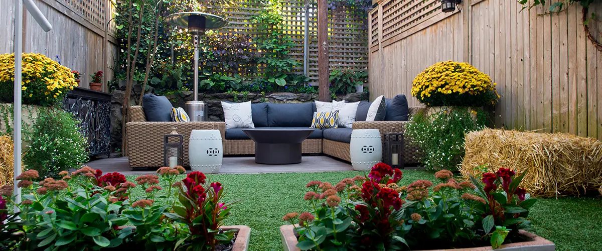 Cozy backyard lounge with fire pit and privacy fencing