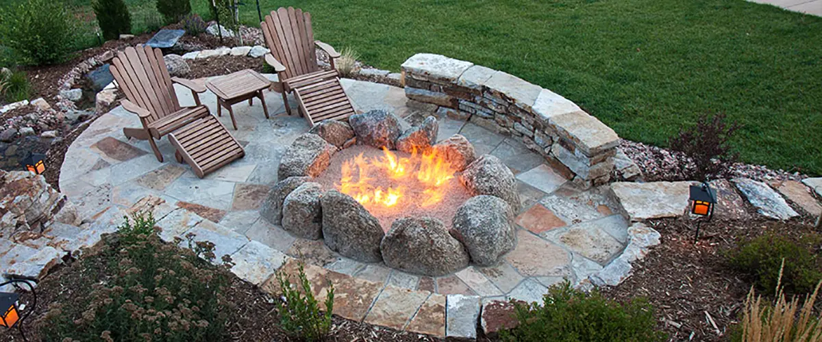 Backyard fire pit with stone seating