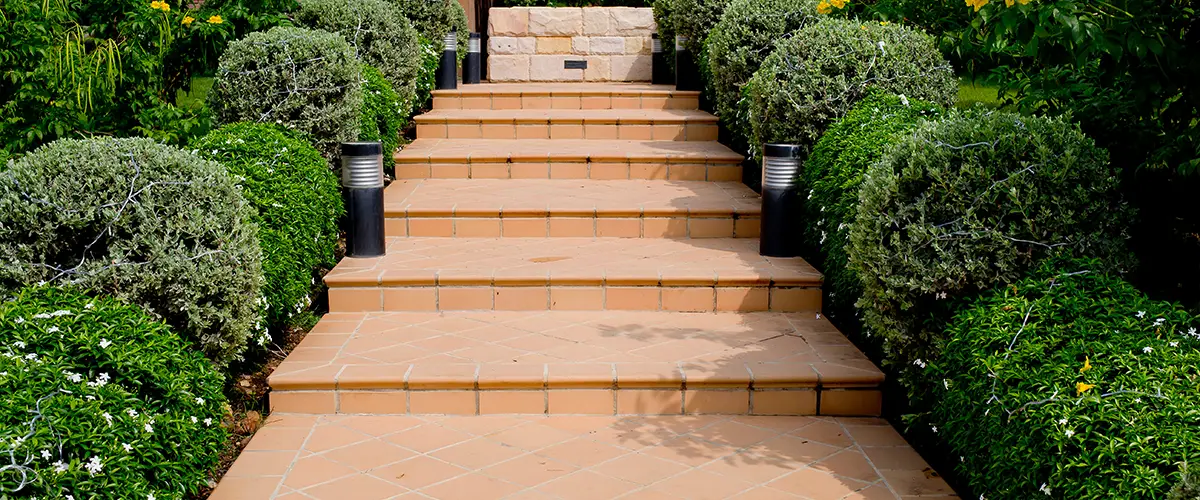 Outdoor tile steps with shrubs and lighting