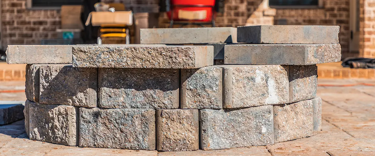Stone fire pit built with interlocking blocks