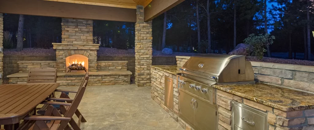 countertop texas outdoor kitchens fireplaces outdoor kitchen with stone fireplace stainless steel grill and wooden dining furniture