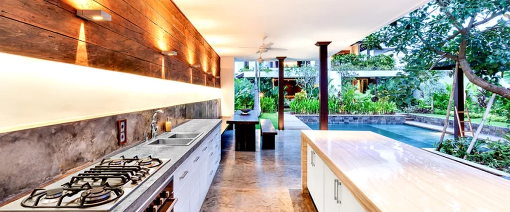 luxurious outdoor kitchen with professional stainless steel appliances and polished countertops