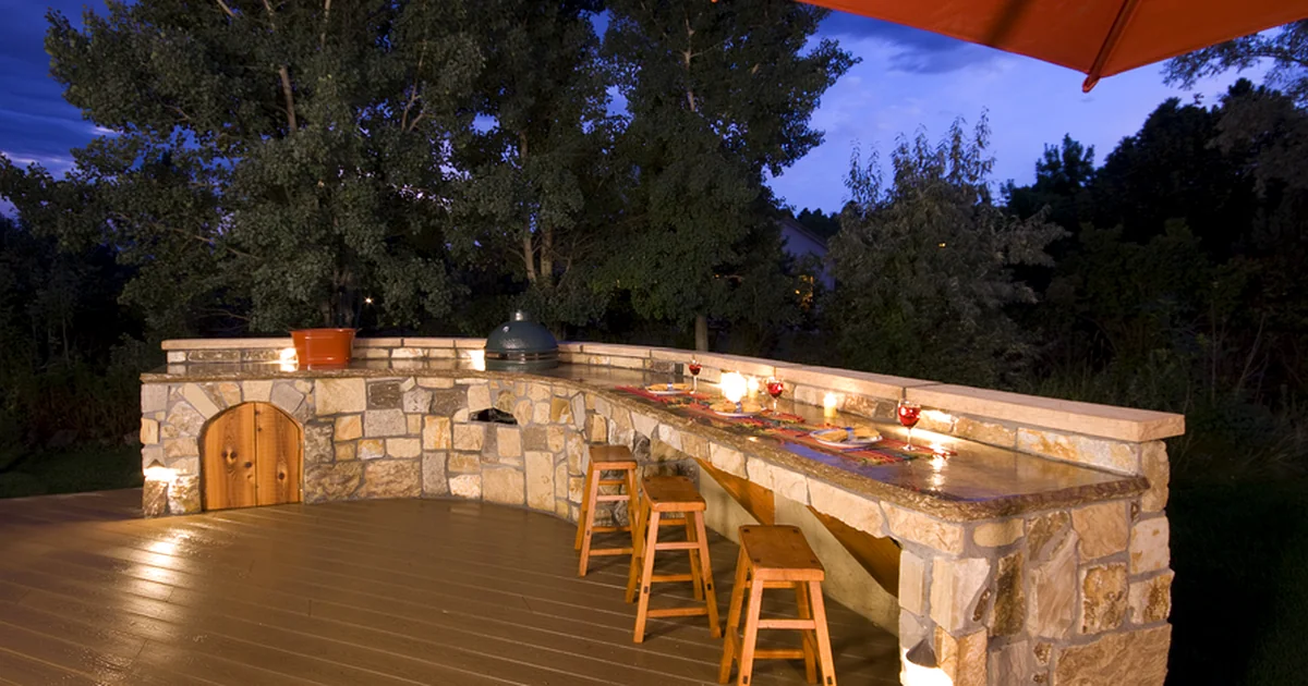 outdoor kitchens fireplaces elegant outdoor kitchen with stone countertops wooden stools and ambient lighting