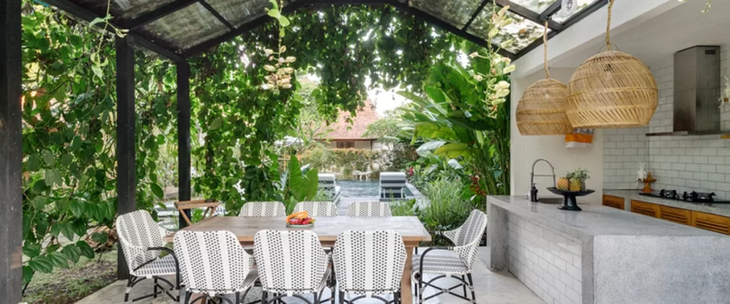 outdoor kitchens fireplaces kitchen layout outdoor kitchen with expert stone countertops wicker chairs lush greenery pergola