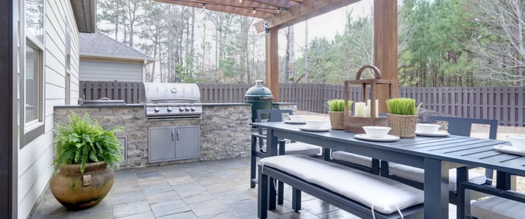 outdoor kitchens fireplaces outdoor patio with pergola commercial grade grill stone countertops and modern dining set