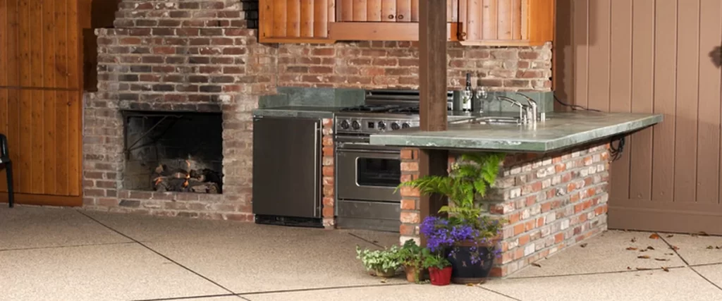 outdoor kitchens fireplaces texas outdoor kitchen with brick fireplace stainless appliances green countertop wooden cabinets
