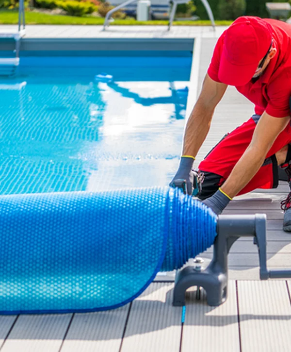 pool builders mckinney tx pool spa installation a professional contractor installs a blue pool cover on a modern deck