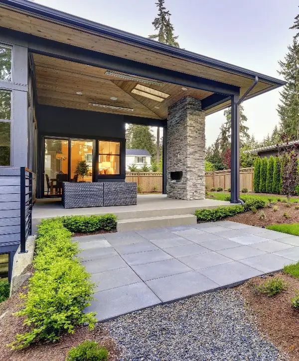 Modern home featuring a spacious covered patio and outdoor living area