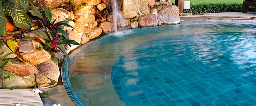 pool spa installation salt water pool a professional saltwater pool with stone waterfall surrounded by lush greenery