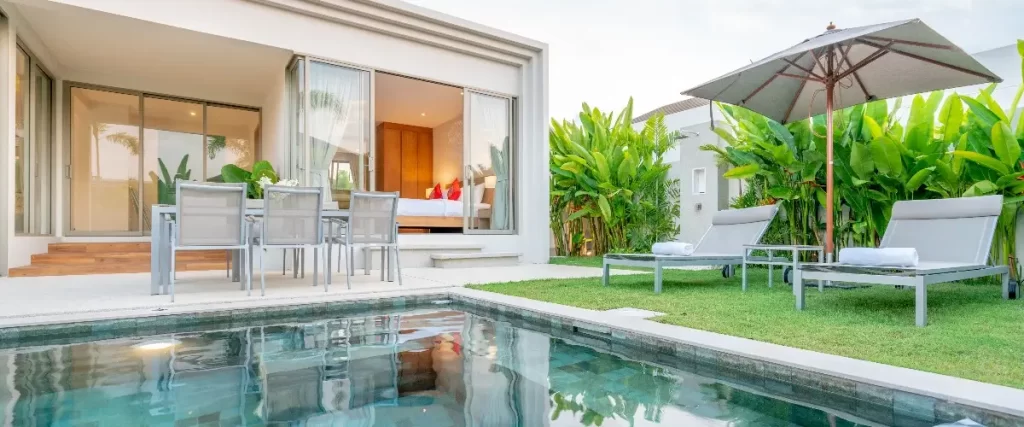 a luxurious outdoor area featuring a private swimming pool and patio