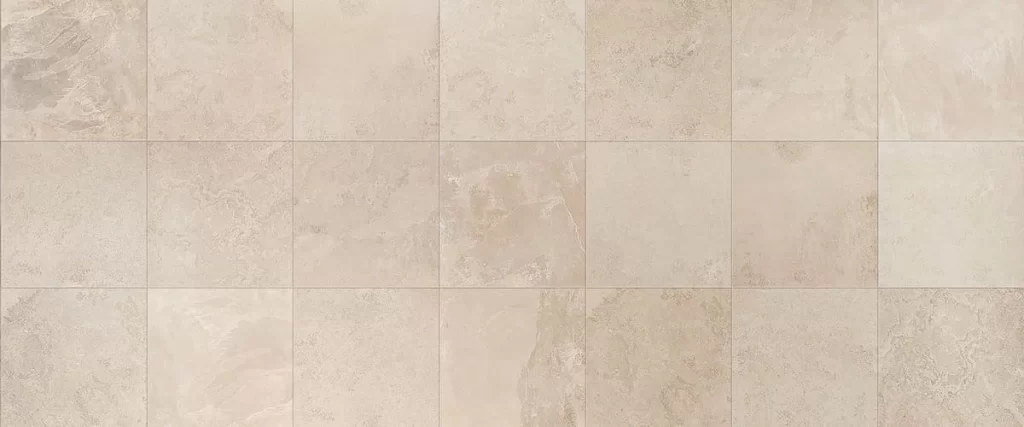 A high-resolution overhead view of square porcelain tiles featuring a light beige natural stone texture with a matte finish and subtle earthy marbling details.