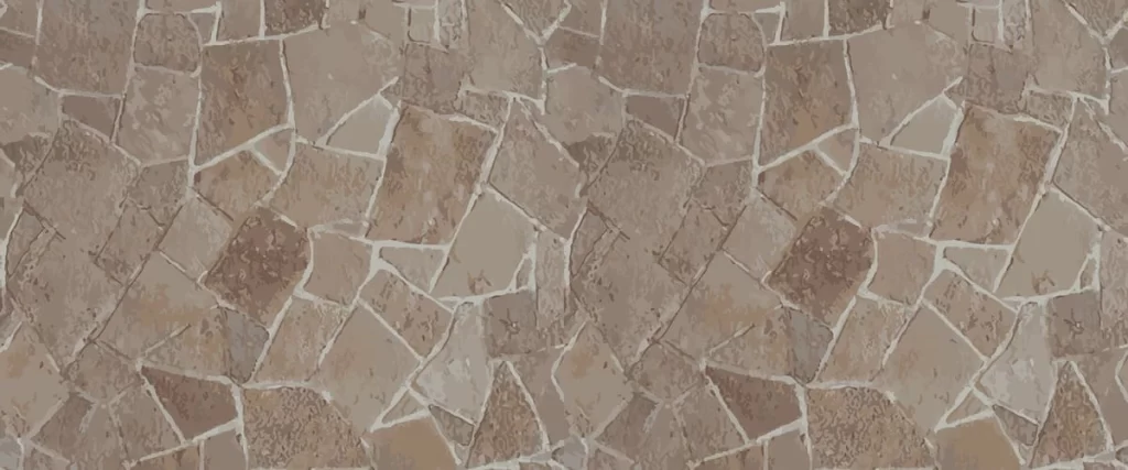 A top-down view of a rustic flagstone surface featuring irregular natural stone shapes in earth tones with light-colored grout lines creating a seamless outdoor patio texture.