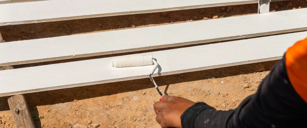 A modern residential backyard featuring a manicured lawn and stone walkway.